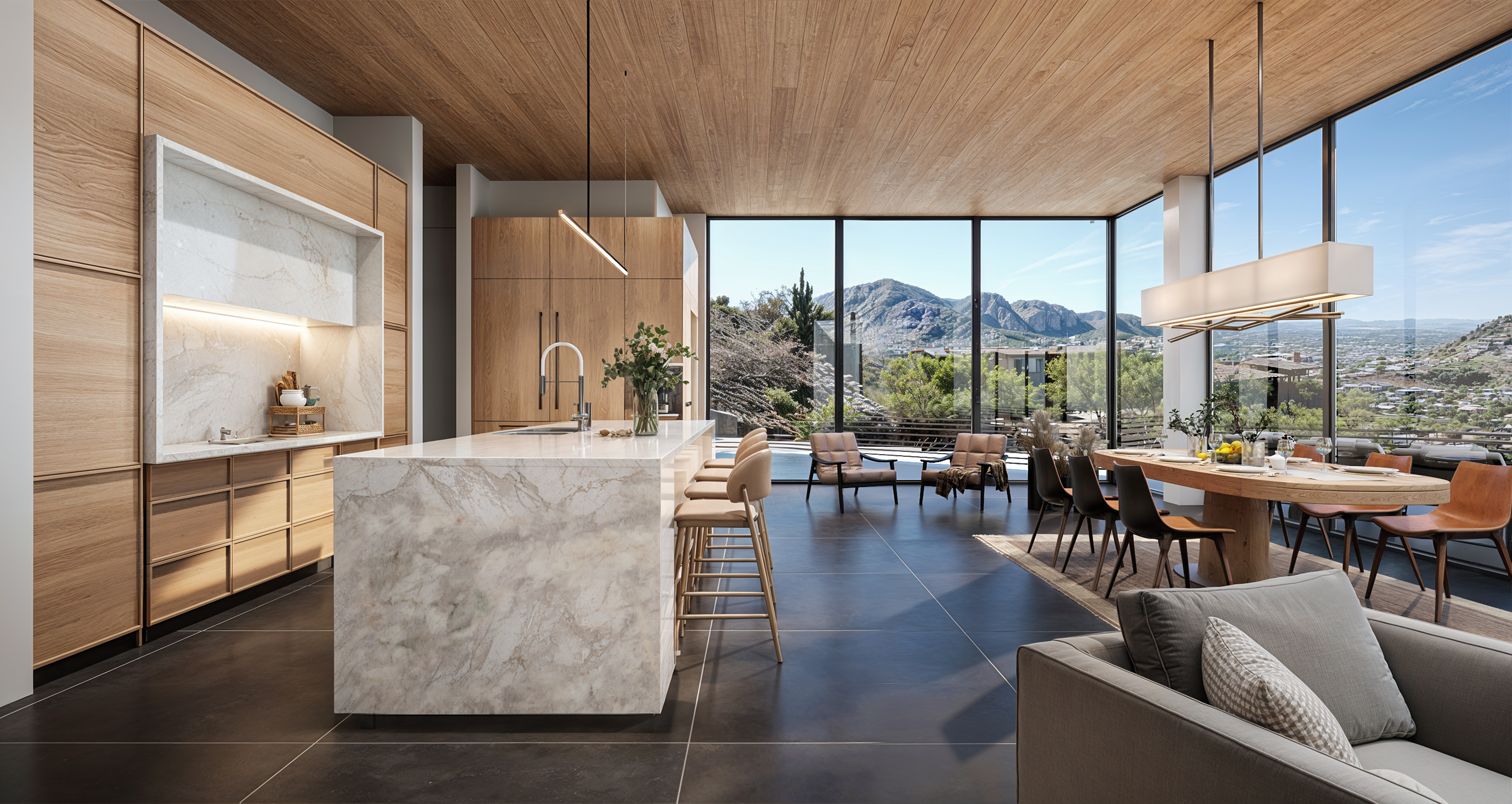 Great room looking out across glass walls to the Phoenix valley and McDowell Mountains