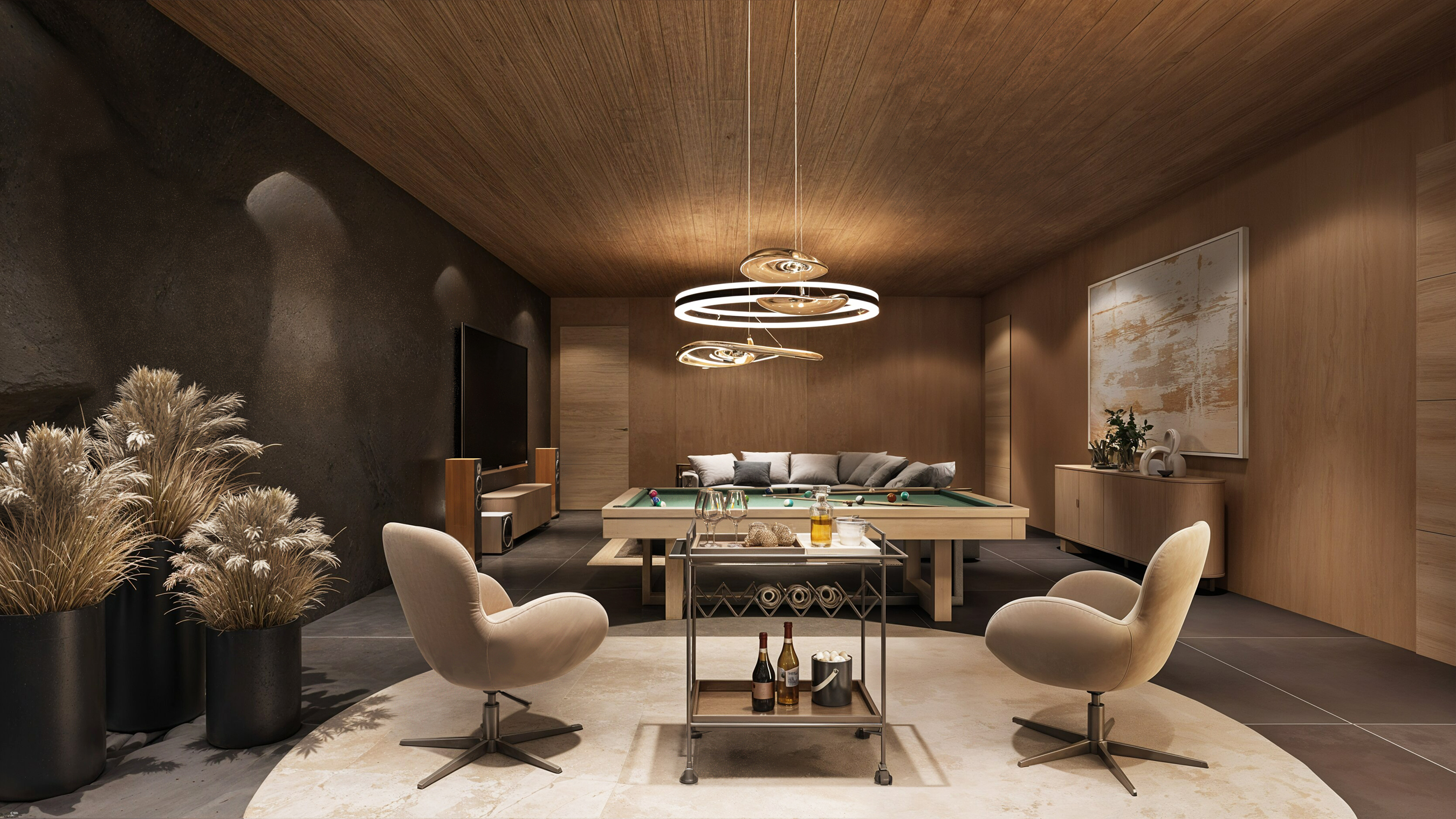 Billiards lounge with sculptural ring chandelier, lounge chairs, bar cart, sectional sofa and pool table